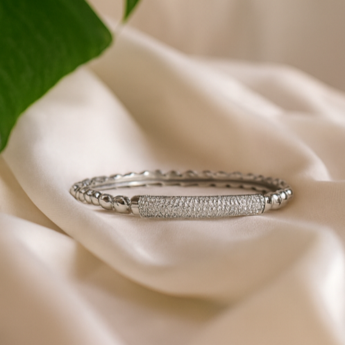 Shimmer Grace Polished Beaded Accent Bangle - PEACORA