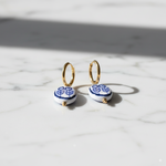 Load image into Gallery viewer, Stainless Steel Hoop Earrings with Blue Floral Charm – Gold Finish - PEACORA
