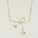Load image into Gallery viewer, Gold Vermeil Bow and Star Necklace
